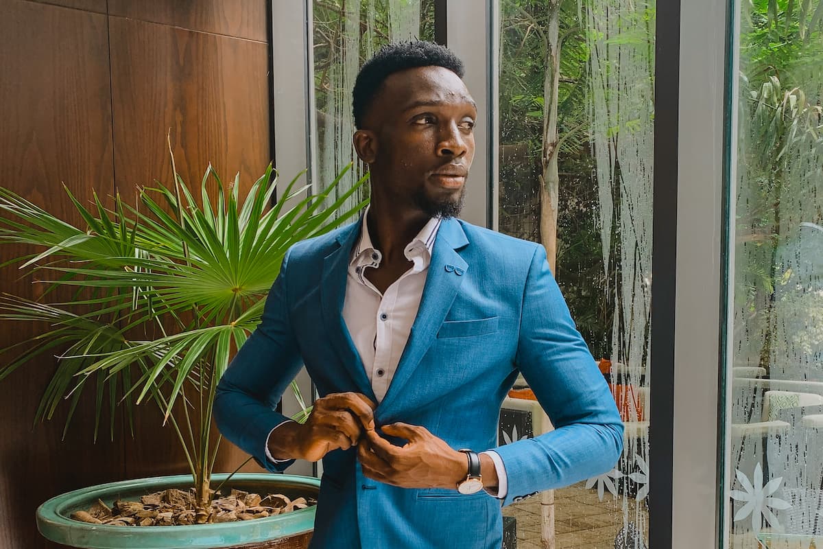 A customer in a finished blue suit at Khimji's